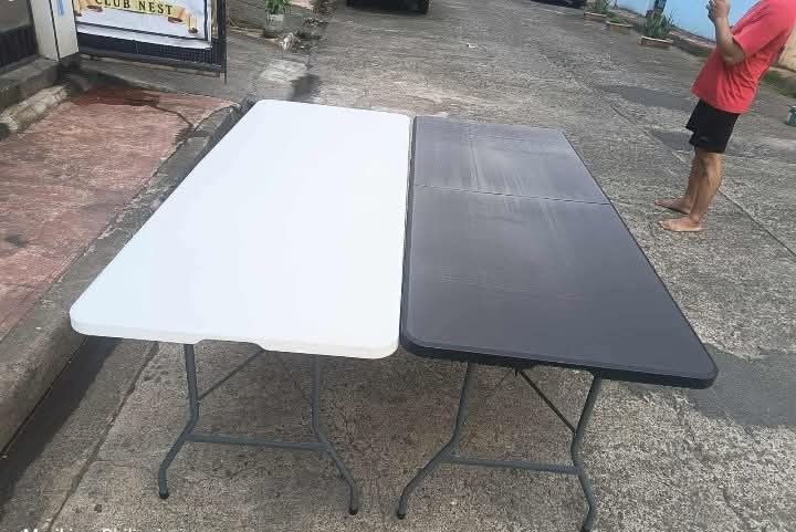 Foldable table (Category: Tables & Sets) located in Manila. Submitted by joydolor (Listing ID 1463363827, Image 1). Description: ✅ HARD PLASTIC FOLDING TABLE ✅ Size 180cmx74cmx76cm MATERIALS: ⭐HIGH DENSITY POLYETHYLENE TABLE TOP ⭐ POWDER COATED STEEL FRAME OTHERS: ⭐UV PROTECTED ⭐ LIGHT WEIGHT ⭐RUST RESISTANT ⭐STAIN RESISTANT ⭐EASY TO CLEAN ⭐FOLD IN HALF ⭐ MULTIFUNCTIONAL FOLDING TABLE ⭐ PICNIC TABLE ⭐PARTY TABLE ⭐FOR BUSINESS USE ⭐HEAVY DUTY ⭐EAS