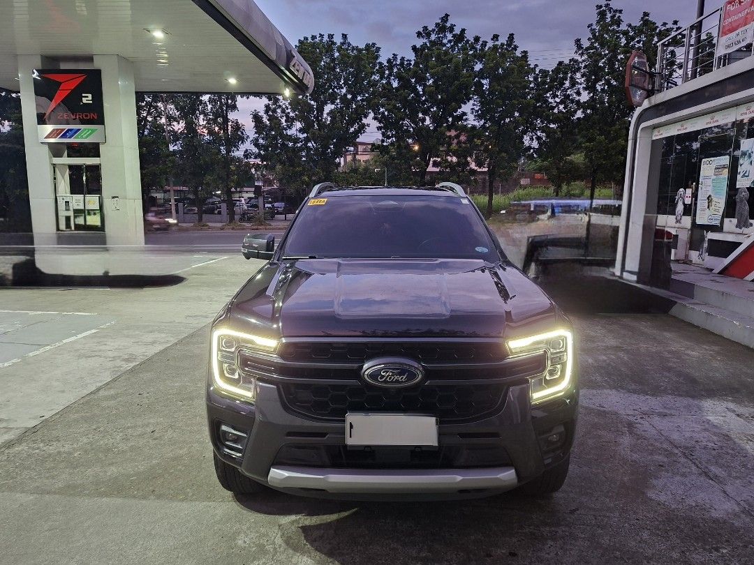 Ford Ranger (Category: Used Cars) located in Quezon City. Submitted by zenpips (Listing ID 1463358175, Image 2). Description: 🚨 FOR SALE — 2024 FORD RANGER WILDTRAK 4x4 🚨 🔥 2.0L Bi-Turbo Diesel | 4x4 | Automatic 🚘 VEHICLE DETAILS • Model: Ford Ranger Wildtrak 4x4 • Year: 2024 • Engine: 2.0L Bi-Turbo Diesel • Transmission: Automatic • Mileage: 54,000 KM • Ownership: First Owner • OR/CR: Complete • Original Purchase Price: ₱1,900,000 • Conditio
