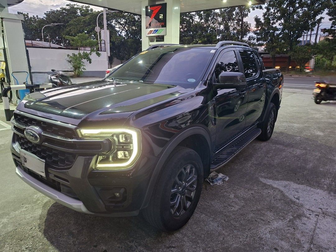 Ford Ranger (Category: Used Cars) located in Quezon City. Submitted by zenpips (Listing ID 1463358175, Image 1). Description: 🚨 FOR SALE — 2024 FORD RANGER WILDTRAK 4x4 🚨 🔥 2.0L Bi-Turbo Diesel | 4x4 | Automatic 🚘 VEHICLE DETAILS • Model: Ford Ranger Wildtrak 4x4 • Year: 2024 • Engine: 2.0L Bi-Turbo Diesel • Transmission: Automatic • Mileage: 54,000 KM • Ownership: First Owner • OR/CR: Complete • Original Purchase Price: ₱1,900,000 • Conditio