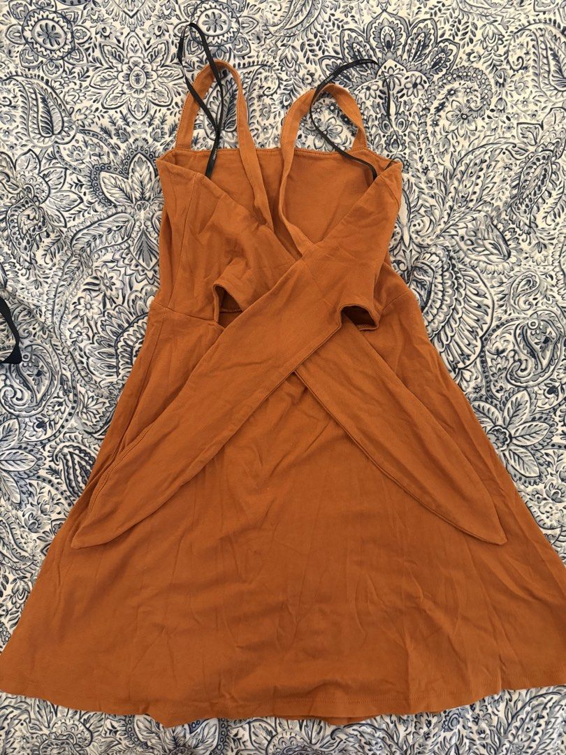 Forever 21 Orange Square Neck Mini Dress (Category: Dresses) located in Dasmarinas. Submitted by declutter.mai (Listing ID 1463406801, Image 2). Description: - Orange mini dress from Forever 21 - Flattering square neckline - Chic criss-cross tie detail at the back - Soft and stretchy fabric for comfort - Versatile for casual outings or dressing up.
