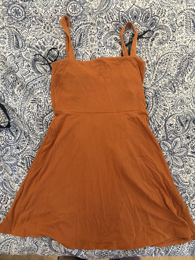 Forever 21 Orange Square Neck Mini Dress (Category: Dresses) located in Dasmarinas. Submitted by declutter.mai (Listing ID 1463406801, Image 1). Description: - Orange mini dress from Forever 21 - Flattering square neckline - Chic criss-cross tie detail at the back - Soft and stretchy fabric for comfort - Versatile for casual outings or dressing up.