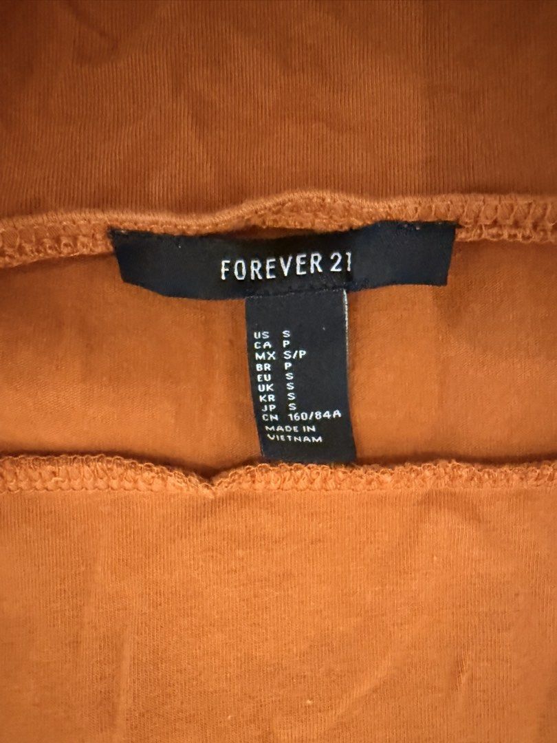 Forever 21 Orange Square Neck Mini Dress (Category: Dresses) located in Dasmarinas. Submitted by declutter.mai (Listing ID 1463406801, Image 3). Description: - Orange mini dress from Forever 21 - Flattering square neckline - Chic criss-cross tie detail at the back - Soft and stretchy fabric for comfort - Versatile for casual outings or dressing up.