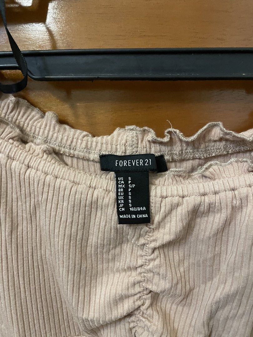 Forever 21 Ribbed Off-Shoulder Long Sleeve Bodysuit (Category: Others Tops) located in Cebu City. Submitted by tarawr (Listing ID 1463449595, Image 3). Description: - Ribbed bodysuit - Off-shoulder neckline with ruffled trim - Ruched detail at the bust - Snap closure at the bottom.