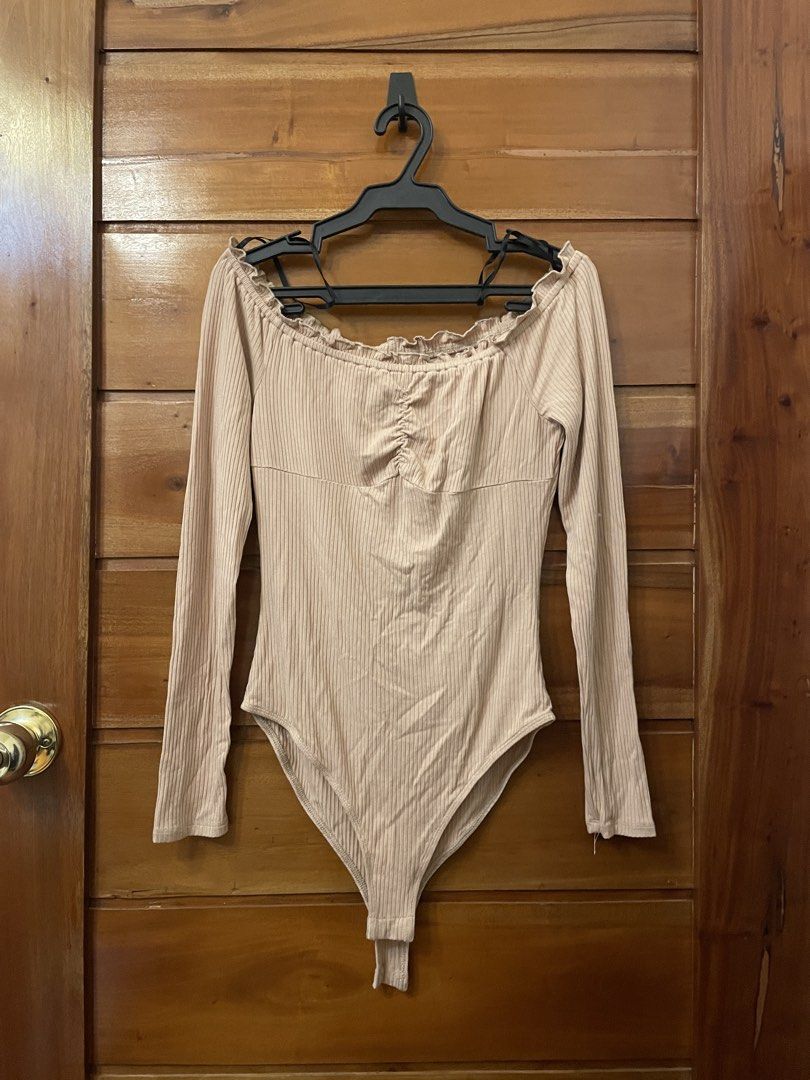 Forever 21 Ribbed Off-Shoulder Long Sleeve Bodysuit (Category: Others Tops) located in Cebu City. Submitted by tarawr (Listing ID 1463449595, Image 1). Description: - Ribbed bodysuit - Off-shoulder neckline with ruffled trim - Ruched detail at the bust - Snap closure at the bottom.
