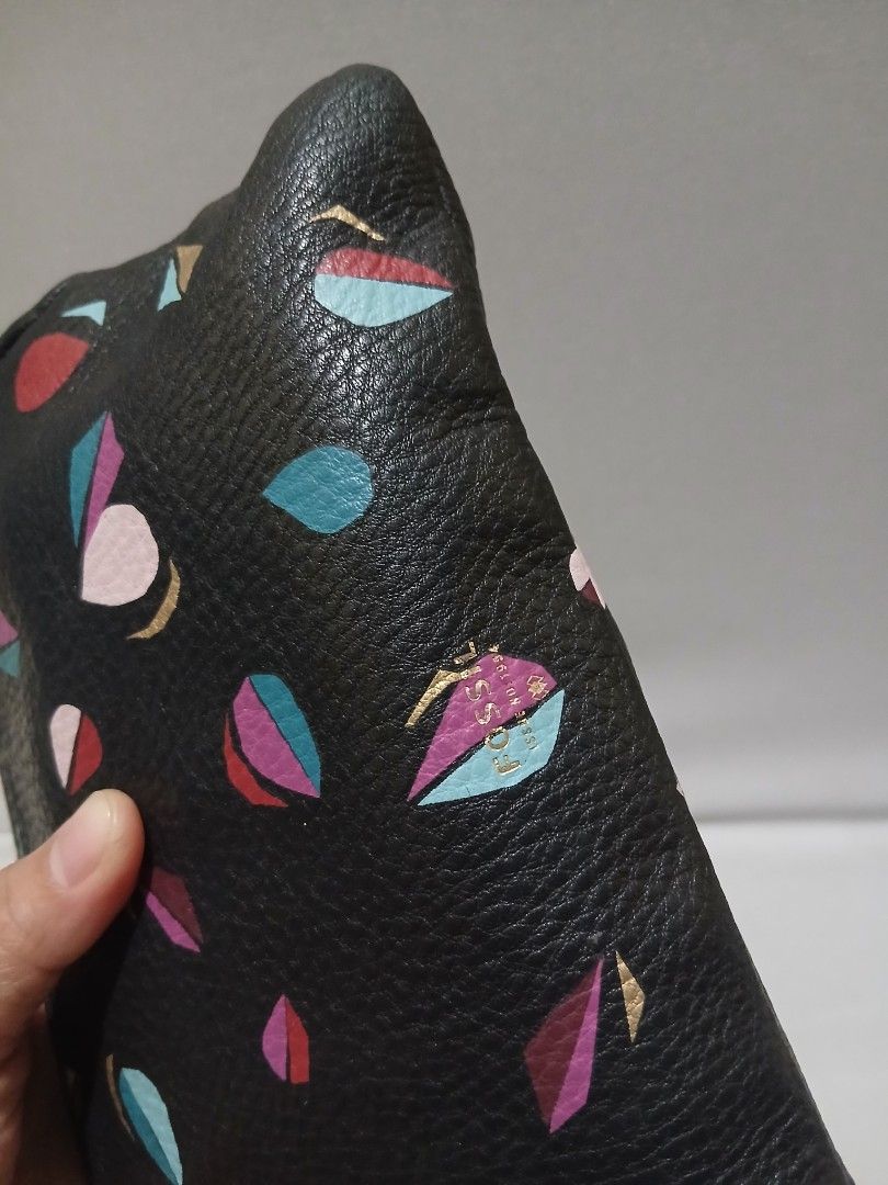 Fossil wristlet SHOULDER BAG LEATHER (Category: Shoulder Bags) located in Bulacan. Submitted by assorted.items (Listing ID 1463483416, Image 3). Description: black pebbled leather Fossil wristlet featuring a colorful abstract leaf or petal pattern with gold-tone hardware..