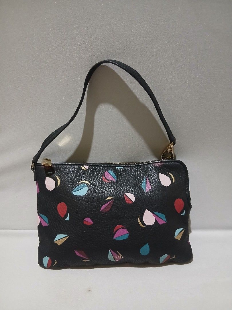 Fossil wristlet SHOULDER BAG LEATHER (Category: Shoulder Bags) located in Bulacan. Submitted by assorted.items (Listing ID 1463483416, Image 1). Description: black pebbled leather Fossil wristlet featuring a colorful abstract leaf or petal pattern with gold-tone hardware..