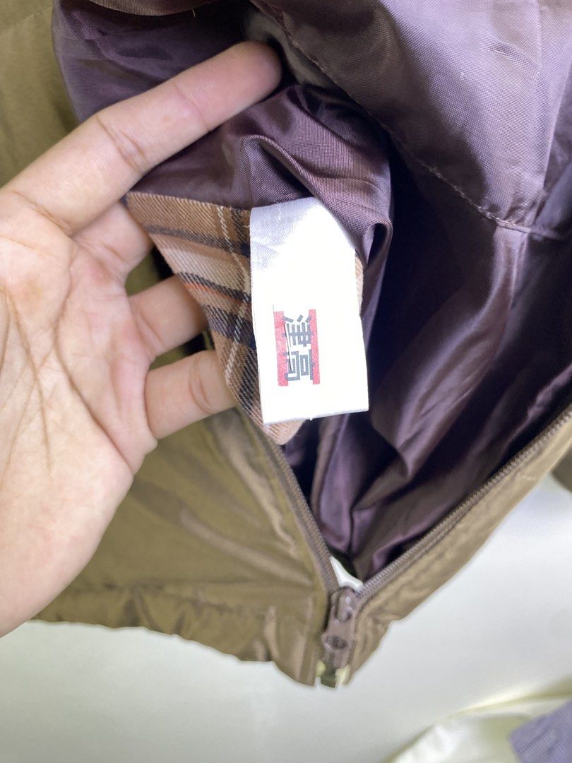 Fred Perry Puffer Jacket Size L (Category: Coats, Jackets and Outerwear) located in Manila. Submitted by declutterpromax (Listing ID 1463402671, Image 3). Description: - Brand: Fred Perry - Type: Brown Puffer Jacket - Lining: Iconic plaid fabric - Detail: Embroidered Fred Perry laurel wreath logo on chest - Closure: Zipper - Feature: Excellent for warmth and style.