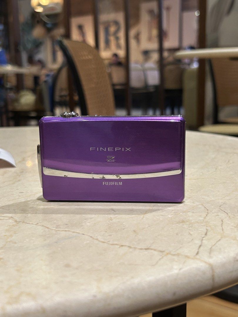 Fujifilm FinePix Z Digital Camera Digicam (Category: Cameras) located in Lagonoy. Submitted by nadayojiii (Listing ID 1463392087, Image 3). Description: Fujifilm FinePix Z💜 NO FUNCTIONAL ISSUES ALL WORKING flash working zoom working touch screen(slightly hard touch because of hairline crack; still touch responsive) clear lcd!! CRISP SHOTS✨ inclusions: unit battery sd card charger strap stickers .