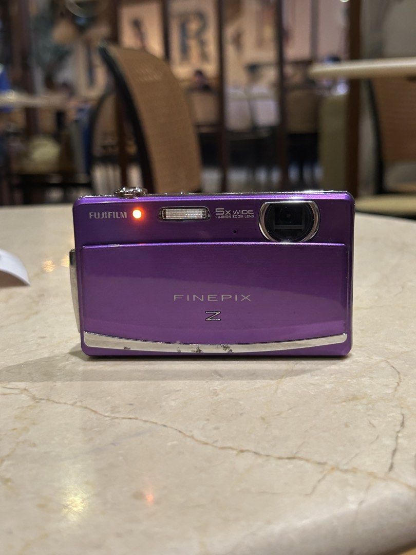 Fujifilm FinePix Z Digital Camera Digicam (Category: Cameras) located in Lagonoy. Submitted by nadayojiii (Listing ID 1463392087, Image 1). Description: Fujifilm FinePix Z💜 NO FUNCTIONAL ISSUES ALL WORKING flash working zoom working touch screen(slightly hard touch because of hairline crack; still touch responsive) clear lcd!! CRISP SHOTS✨ inclusions: unit battery sd card charger strap stickers .