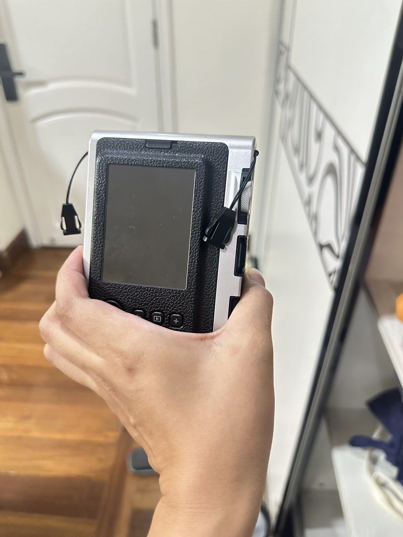 Fujifilm Instax Mini Evo Hybrid Instant Camera (Category: Cameras) located in San Juan City. Submitted by rose.lucky (Listing ID 1463440650, Image 1). Description: - Fujifilm Instax Mini Evo hybrid instant camera - Color: Black and Silver - Lens: Instax Lens 28mm F2.0 - Focus Range: 0.1m to infinity - Comes with original box - Perfect for capturing memories.