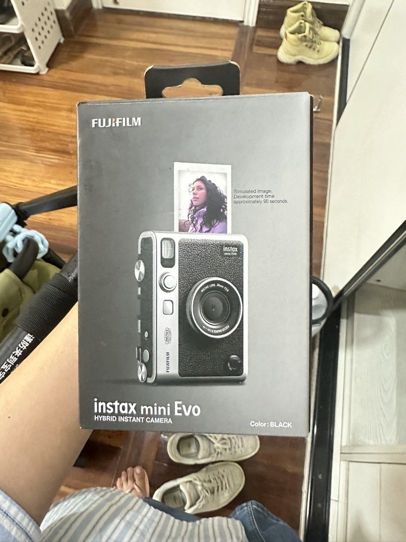 Fujifilm Instax Mini Evo Hybrid Instant Camera (Category: Cameras) located in San Juan City. Submitted by rose.lucky (Listing ID 1463440650, Image 3). Description: - Fujifilm Instax Mini Evo hybrid instant camera - Color: Black and Silver - Lens: Instax Lens 28mm F2.0 - Focus Range: 0.1m to infinity - Comes with original box - Perfect for capturing memories.