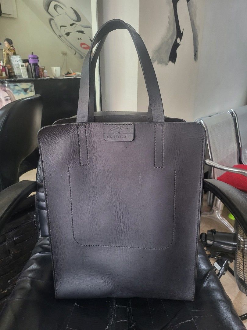 Full grain Black Leather Tote Bag (Category: Tote Bags) located in Manila. Submitted by milkymitch23 (Listing ID 1463461624, Image 1). Description: - Classic black leather tote - Simple and functional design - Convenient front pocket - Sturdy straps for durability - Ideal for everyday use - Approximate dimensions: 13" (height) x 11" (width) - artisan - genuine leather. solid.