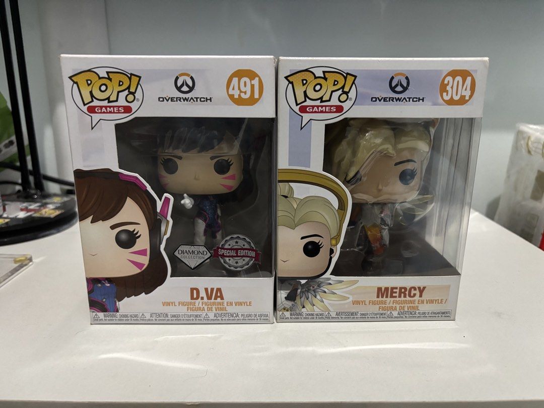 Funko Pop Overwatch d.va 491 & Mercy 304 Bundle (Category: Designer & Blind Box Toys) located in Manila. Submitted by lvlup_toys (Listing ID 1463436730, Image 1). Description: Please Take Time to Read !!! All in good Condition unless stated Protectors Included funko overwatch set of 2 D.VA #491 (Diamond Collection SE) Mercy #304 Condition slight yellowing due to age Payment: Bank transfer (BPI/GOTYME) MoS: For Pickup ot Shipping only (LALAMOVE/GR
