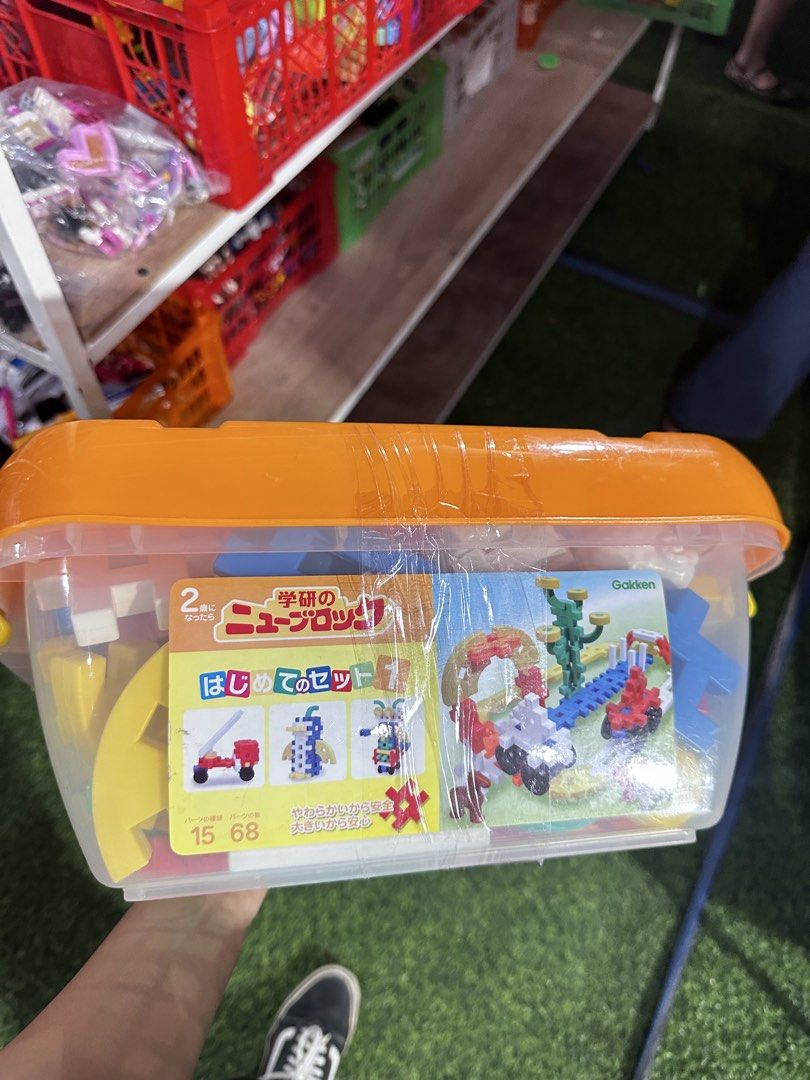 Gakken New Blocks "First Set" Building Toy (Category: Educational & Learning Toys) located in Manila. Submitted by jailand08 (Listing ID 1463509400, Image 1). Description: - Gakken New Blocks "First Set" building toy - Recommended for ages 2 and up - Includes 15 types of parts and 68 pieces total - Soft and safe for little ones - Great for developing creativity and fine motor skills - Comes in a clear plastic storage tub with an orange lid.