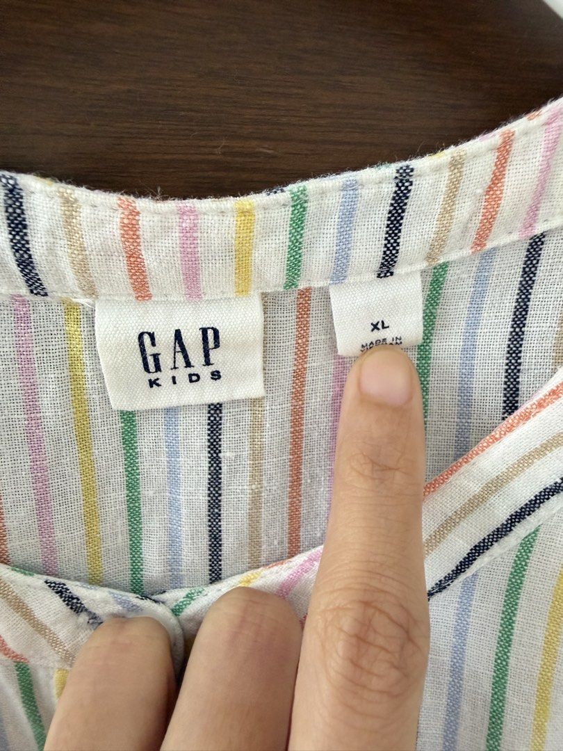 GAP Kids Striped Romper XL (Category: Babies & Kids Fashion) located in San Fernando. Submitted by lovepreloved13 (Listing ID 1463329515, Image 2). Description: - Cute GAP Kids romper - Colorful vertical stripe pattern - Elastic waist with drawstring - Button-up front - Sleeveless design - Great for casual wear.