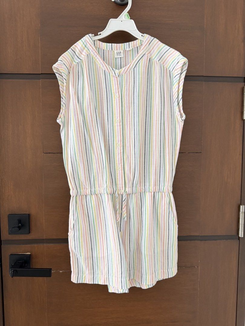 GAP Kids Striped Romper XL (Category: Babies & Kids Fashion) located in San Fernando. Submitted by lovepreloved13 (Listing ID 1463329515, Image 1). Description: - Cute GAP Kids romper - Colorful vertical stripe pattern - Elastic waist with drawstring - Button-up front - Sleeveless design - Great for casual wear.