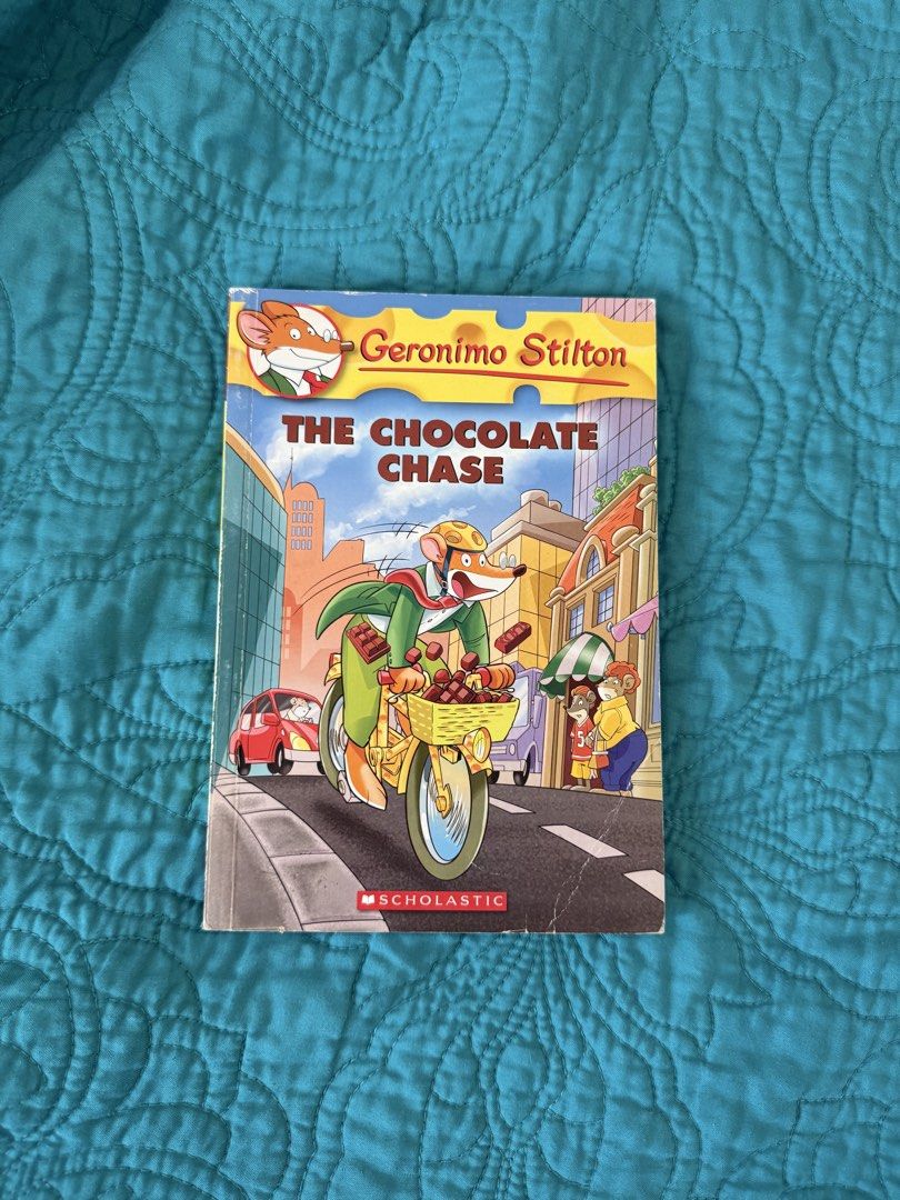 Geronimo Stilton: The Chocolate Chase Scholastic Book (Category: Children's Books) located in Quezon City. Submitted by krisallie (Listing ID 1463419616, Image 1). Description: - Geronimo Stilton: The Chocolate Chase book - Scholastic edition - Reading level: Grade 4 - Genre: Adventure & Mystery - Plot: Exciting chocolate egg hunt in New Mouse City - Ideal for young readers who love fun and engaging stories.
