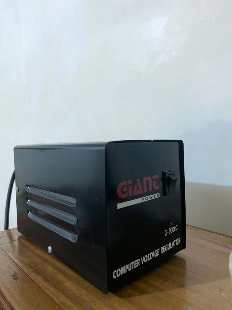 Giant Power G-500LC Computer Voltage Regulator (Category: Electrical, Adaptors & Sockets) located in Caloocan City. Submitted by clarenohctis (Listing ID 1463347687, Image 1). Description: - Giant Power Voltage Regulator - Model: G-500LC - Color: Black - Features: Vents on the side, On/Off switch - Function: Protects computer equipment from voltage fluctuations - Condition: Tested and working.