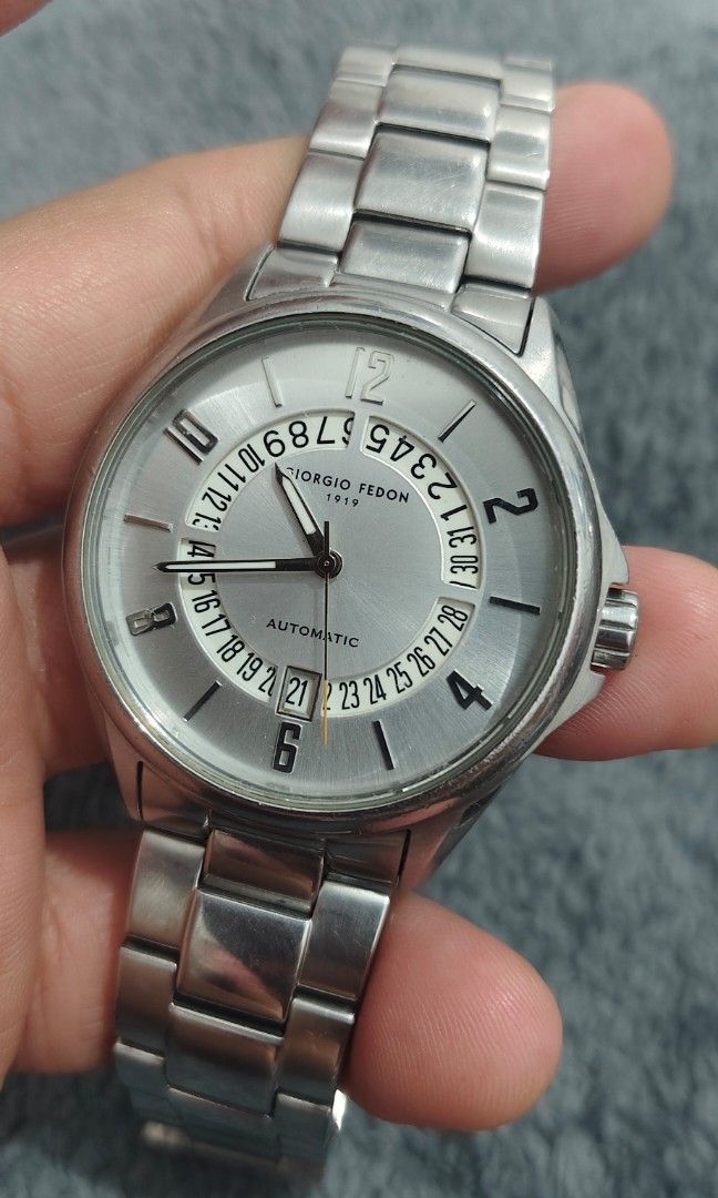 Giorgio Fedon 1919 (Category: Men's Watches) located in Cebu City. Submitted by aceoftime (Listing ID 1463489396, Image 1). Description: In good working condition Automatic movt with retrograde design calendar All in stainless steel Flawless crystal ( No scratches) Watch only Our Guarantee: 💯 Authentic All watches are checked by our experienced technician to ensure good functionality Please manage your expectations since these are preloved watch