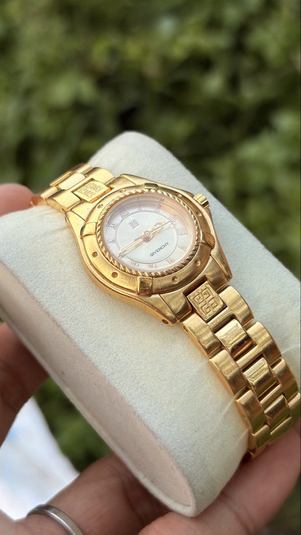 Givenchy Gold Watch (Category: Luxury Watches) located in Merida. Submitted by opustimepieces2026 (Listing ID 1463492027, Image 1). Description: - Genuine Givenchy watch in a luxurious gold finish. - Features classic Roman numerals on the watch face. - Bracelet showcases the iconic Givenchy logo pattern. - A timeless piece that effortlessly elevates any outfit. - Perfect for both formal and casual wear. - An exquisite addition to any watch collec