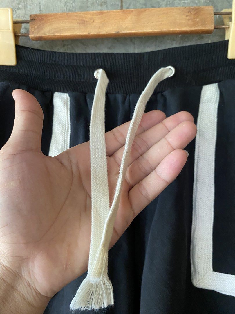 Givenchy Paris Black Shorts with White Trim (Category: Shorts) located in Badiangan. Submitted by iralorana.thrift (Listing ID 1463457622, Image 3). Description: - Authentic Givenchy Paris black shorts - Stylish white trim on pockets and sides - Comfortable drawstring waist - Back pocket with iconic Givenchy logo - Ideal for everyday casual wear.