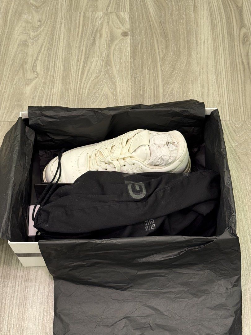 Givenchy White Leather Sneakers with Box (Category: Sneakers) located in Manila. Submitted by silent_dosss (Listing ID 1463378858, Image 1). Description: - Authentic Givenchy white leather sneakers - Classic low-top design - White laces - Light cream colored soles - Includes original Givenchy box - Ideal for everyday wear.