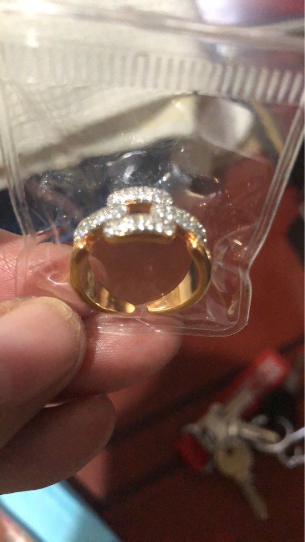 Gold Ring with Clear Stones (Category: Rings) located in Paranaque City. Submitted by luxthings.etc. (Listing ID 1463538388, Image 1). Description: - Gold-colored ring - Rectangular pattern of small clear stones - Open band for adjustable sizing - Adds a touch of sparkle to any outfit - Likely costume jewelry.