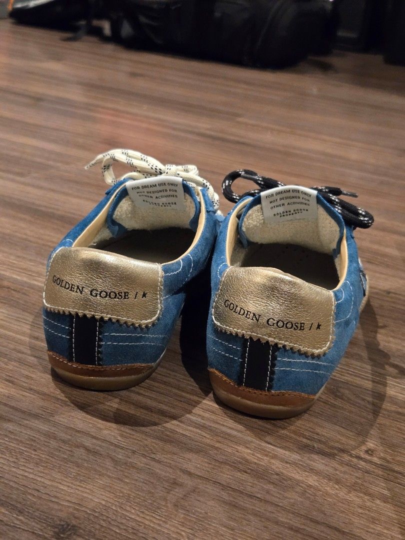 Golden Goose True Star BNEW GGDB (Category: Sneakers) located in Manila. Submitted by chocomoose (Listing ID 1463391417, Image 3). Description: Bnew in box. Size 38 Authentic. Bought in GG boutique in Greenbelt The True-Star features a soft teal suede upper, a white toe cap, and a black laminated leather star. A cream-coloured leather insert is positioned on the back, complemented by a platinum-foiled leather heel tab. The design includes two-ton