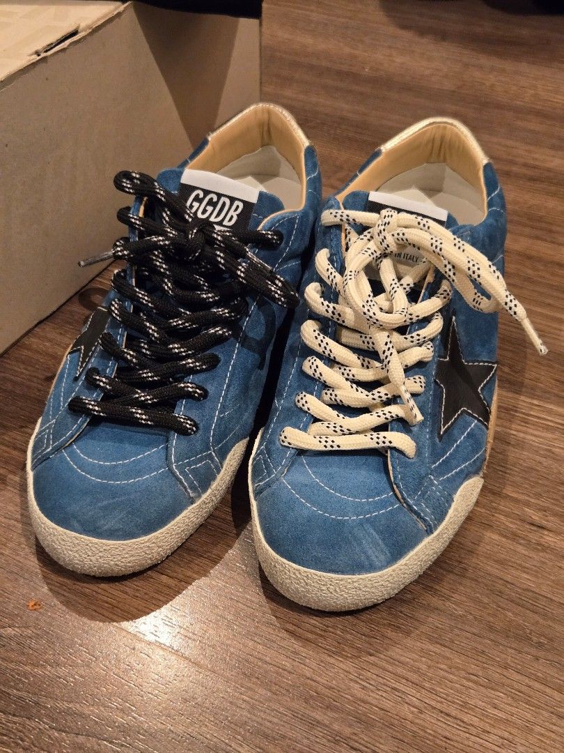 Golden Goose True Star BNEW GGDB (Category: Sneakers) located in Manila. Submitted by chocomoose (Listing ID 1463391417, Image 1). Description: Bnew in box. Size 38 Authentic. Bought in GG boutique in Greenbelt The True-Star features a soft teal suede upper, a white toe cap, and a black laminated leather star. A cream-coloured leather insert is positioned on the back, complemented by a platinum-foiled leather heel tab. The design includes two-ton