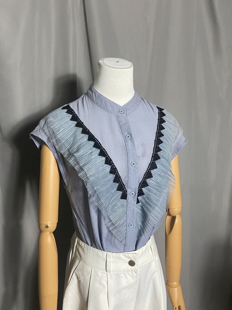 Grayish blue button-down top with black lace ruffle trim (Category: Shirts) located in Las Pinas. Submitted by ipickyou (Listing ID 1463474476, Image 2). Description: Unwashed 𝗠𝗲𝗮𝘀𝘂𝗿𝗲𝗺𝗲𝗻𝘁𝘀 𝘄𝗵𝗲𝗻 𝗹𝗮𝗶𝗱 𝗳𝗹𝗮𝘁: -Armpit to armpit: 17 1/2” -Length: 23”.
