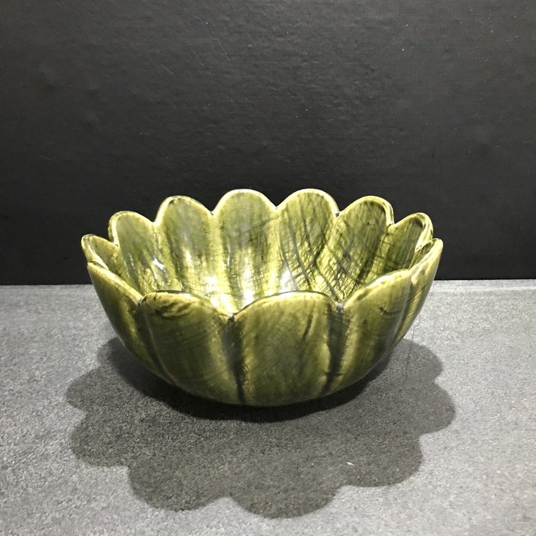 Green Ceramic Lotus Flower Shaped Serving Bowl (Category: Dinnerware & Cutlery) located in Baao. Submitted by all.things.japan (Listing ID 1463550599, Image 2). Description: 7.5 x 3.5 inches - Unique green ceramic bowl - Shaped like a lotus flower with scalloped edges - Ideal for serving snacks, dips, or as a decorative piece - Features a textured glaze finish - Dimensions: Approx. 7 inches across, 3 inches deep - Adds a vibrant pop of color to y