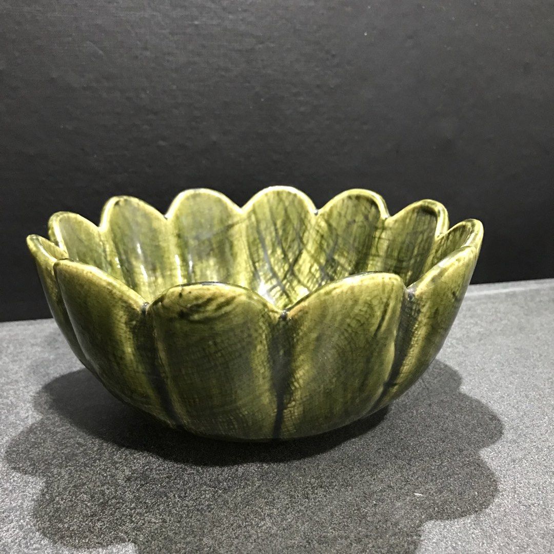 Green Ceramic Lotus Flower Shaped Serving Bowl (Category: Dinnerware & Cutlery) located in Baao. Submitted by all.things.japan (Listing ID 1463550599, Image 3). Description: 7.5 x 3.5 inches - Unique green ceramic bowl - Shaped like a lotus flower with scalloped edges - Ideal for serving snacks, dips, or as a decorative piece - Features a textured glaze finish - Dimensions: Approx. 7 inches across, 3 inches deep - Adds a vibrant pop of color to y