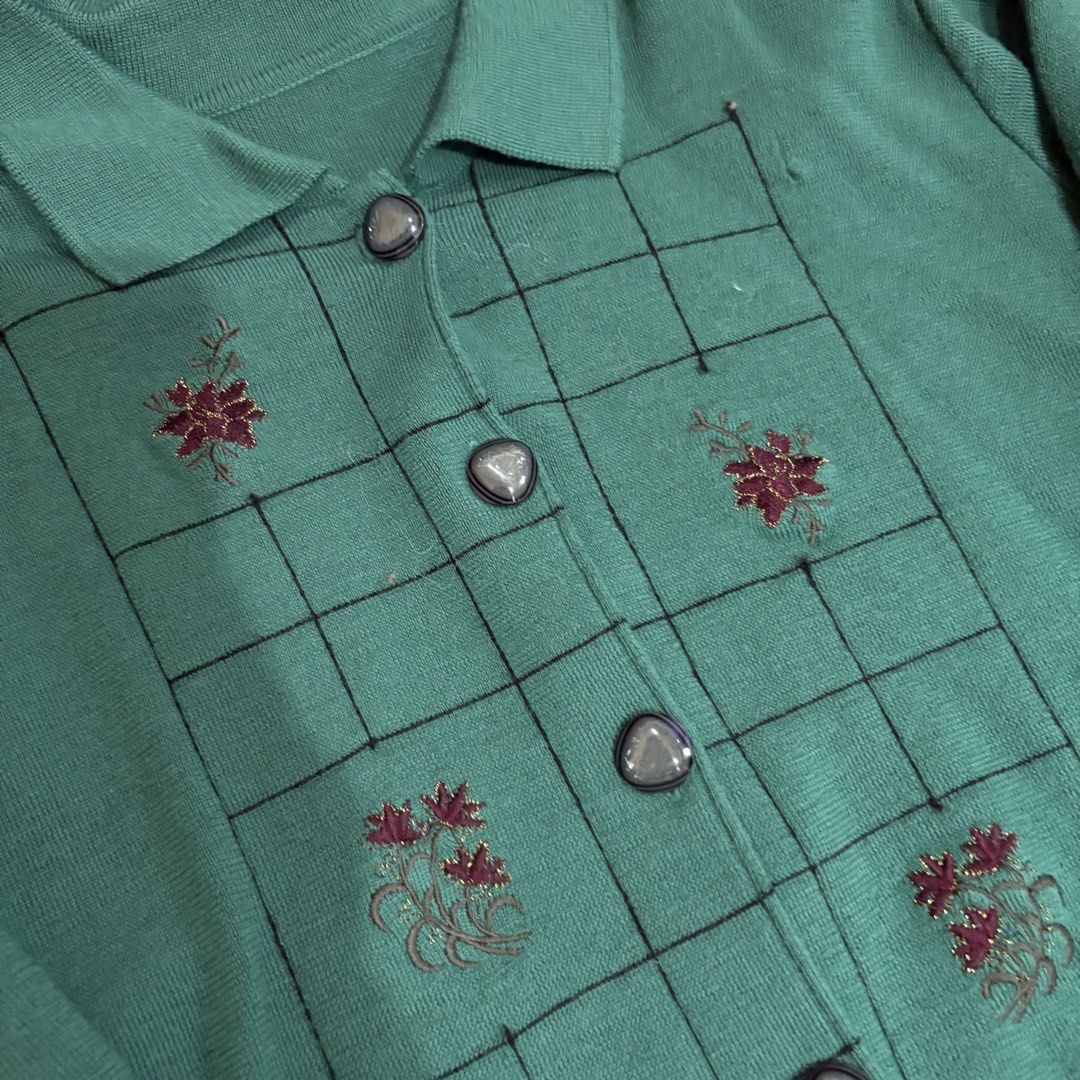Green Embroidered Button-Up Cardigan (Category: Coats, Jackets and Outerwear) located in Makati City. Submitted by sseurekiii (Listing ID 1463348362, Image 2). Description: - Cozy green knit cardigan - Collared neckline - Front button closure - Unique embroidered floral details in a grid pattern - Ideal for layering and adding a touch of style.