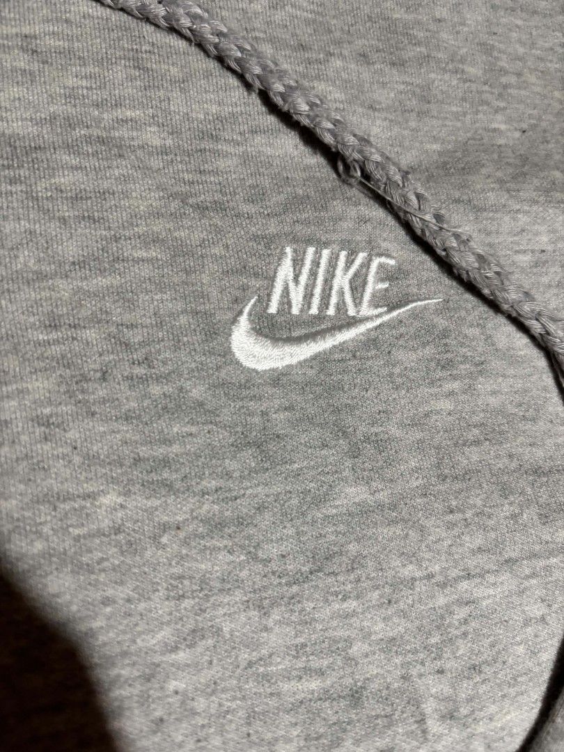 Grey Nike Hoodie Size 2XL (Category: Hoodies) located in Lapu Lapu. Submitted by markbel26 (Listing ID 1463515284, Image 2). Description: - Grey Nike Hoodie - Size: 2XL - Material: 100% Polyester - Made in Malaysia - Features classic embroidered Nike swoosh logo on chest - Front kangaroo pocket - Drawstring hood - Ideal for casual wear.