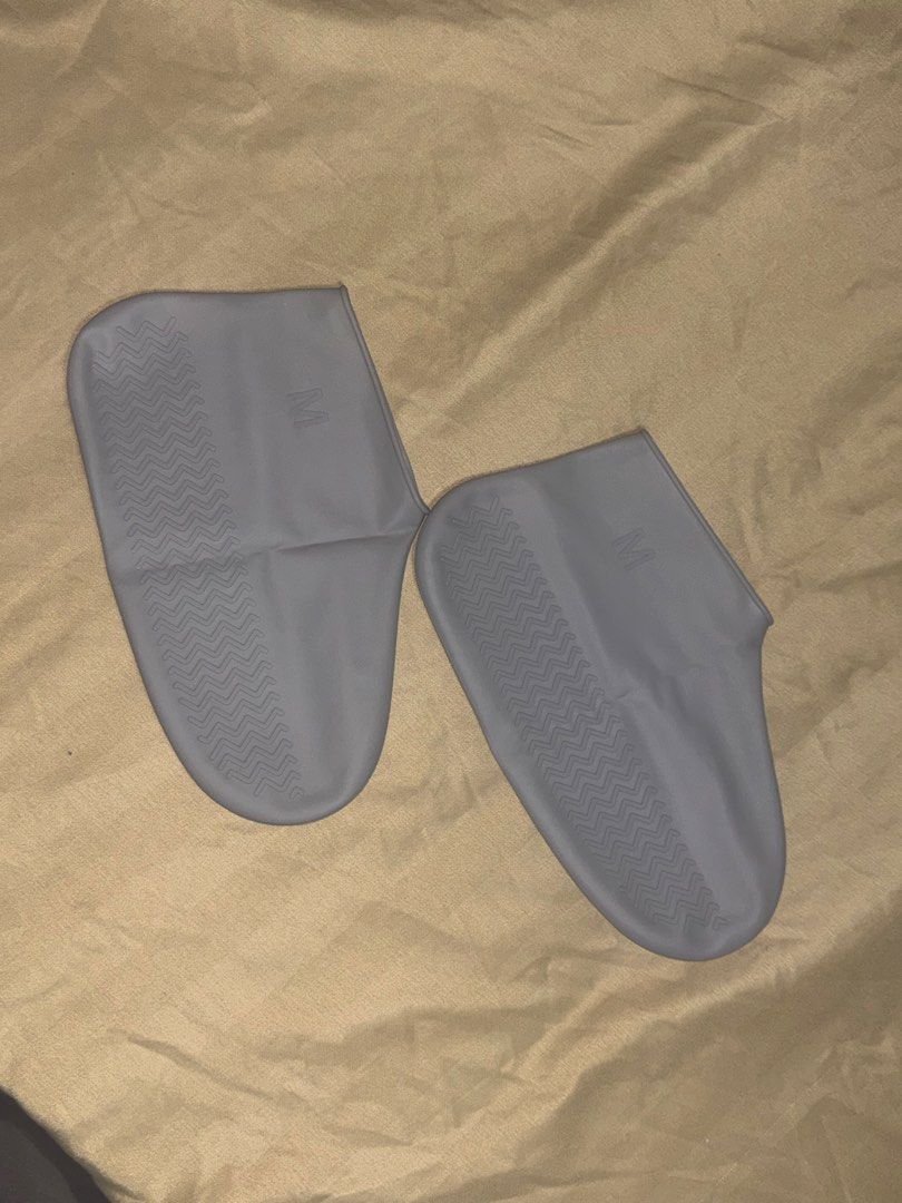 Grey Reusable Silicone Shoe Covers (Category: Shoe inserts) located in Pasay City. Submitted by christinetek (Listing ID 1463539557, Image 1). Description: - Waterproof silicone shoe covers - Ideal for rainy days or protecting shoes - Non-slip sole pattern for safety - Size: Medium (M) - Reusable and durable for long-term use.