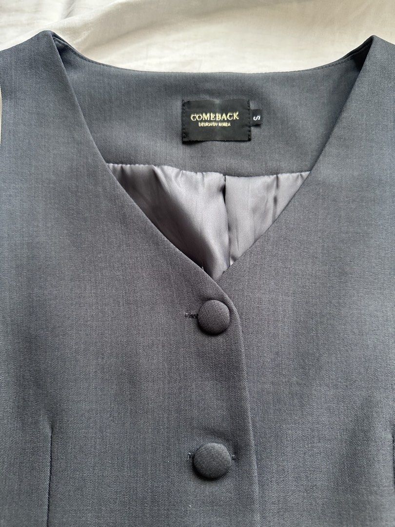 Comeback bkk Grey Vest & Pants Set / coordinates (Category: Sets or Coordinates) located in Taguig. Submitted by beatrizangela (Listing ID 1463405078, Image 3). Description: - never worn, bought in Bangkok - COMEBACK DESIGN BY KOREA grey vest and pants set - Vest features 4 buttons and 2 front pockets - Pants have an elastic waistband and button closure - Size S - Ideal for a smart casual outfit.
