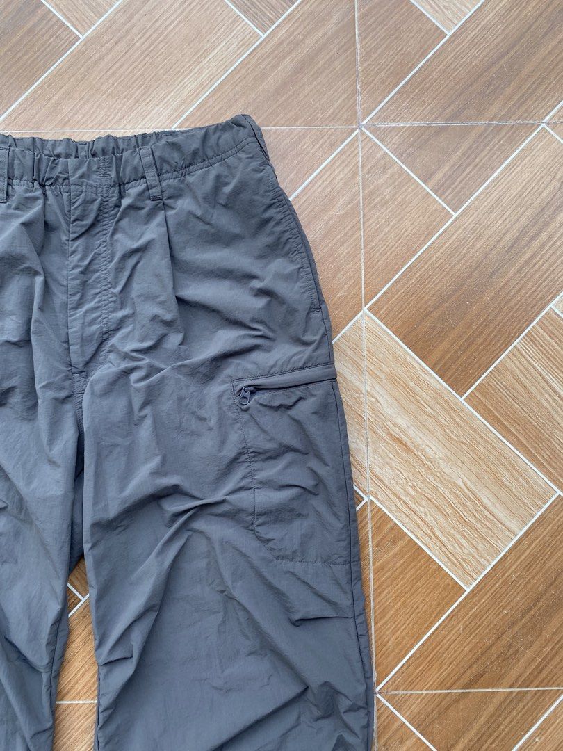 GU Cargo Pants Size L Grey Drawstring Waist (Category: Joggers) located in Davao. Submitted by thirdy.pfp (Listing ID 1463416215, Image 2). Description: GU Parachute Pants dark gray 32-34 waistline 41 lengh 12 thighs 10 hem Excellent 700 - Grey cargo pants from GU - Elastic waistband with drawstring for a comfortable fit - Multiple functional pockets, including one with a secure zip closure - Adjustable drawstring at the hem for a customizable lo