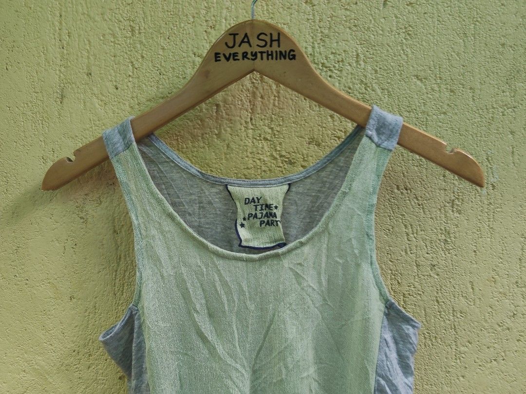 GU Women's Tank Top (Category: Sleeveless) located in City of Isabela. Submitted by jasheverything (Listing ID 1463481030, Image 2). Description: - Lightweight tank top from JASH EVERYTHING - Textured light green front panel - Grey marled back and sides - Slightly curved hemline - Made in China - Ideal for layering or wearing on its own Excellent Condition 300+SF.