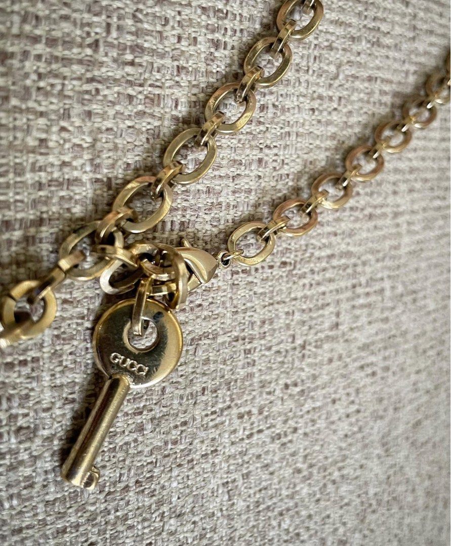 Gucci Keychain with Key and Charm (Category: Charms) located in Bulacan. Submitted by thriftbagcollections (Listing ID 1463442910, Image 3). Description: - Authentic Gucci keychain - Features iconic Gucci logo on round charm and key - Gold-toned metal - Great accessory for bags or keys.
