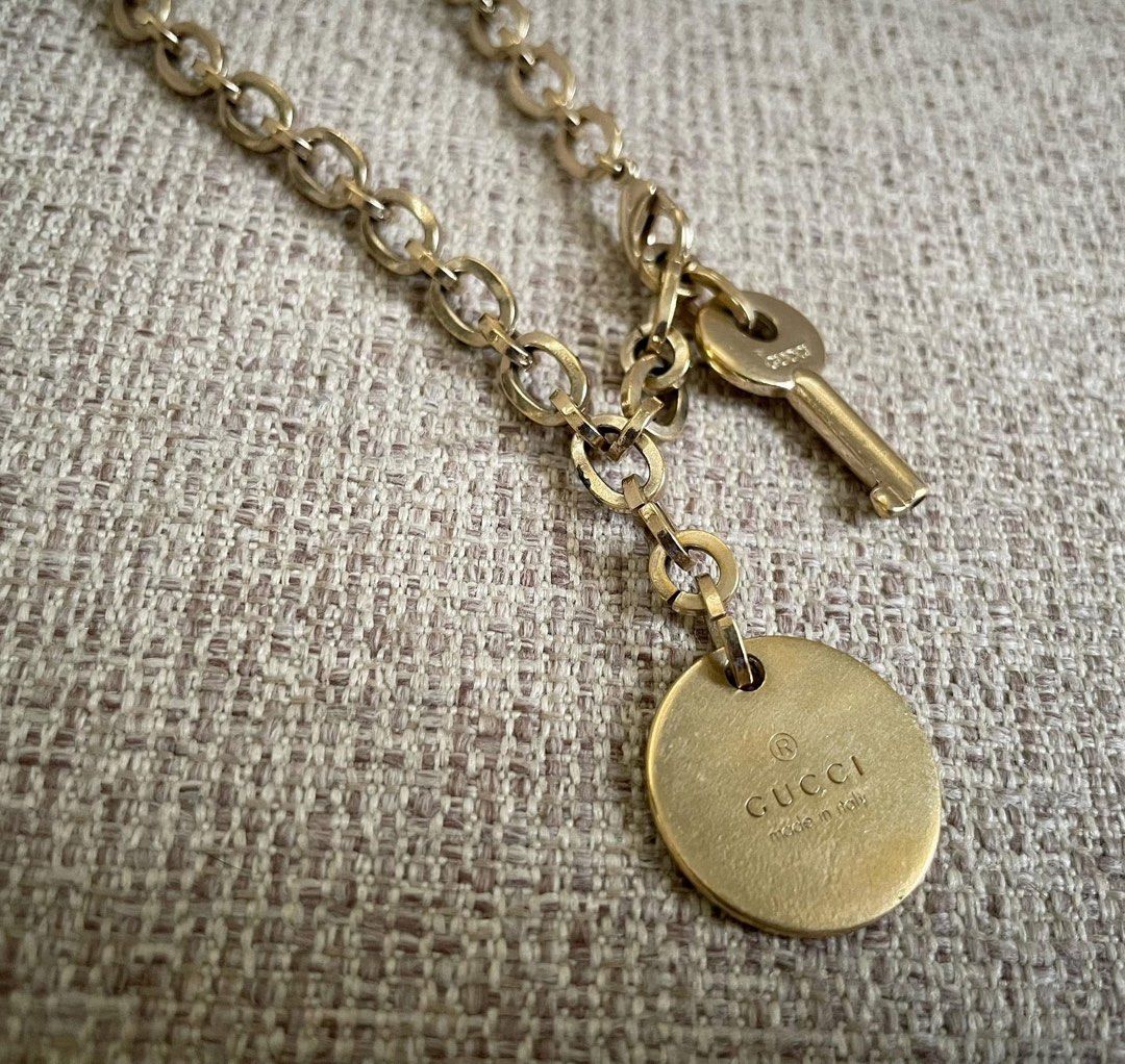 Gucci Keychain with Key and Charm (Category: Charms) located in Bulacan. Submitted by thriftbagcollections (Listing ID 1463442910, Image 2). Description: - Authentic Gucci keychain - Features iconic Gucci logo on round charm and key - Gold-toned metal - Great accessory for bags or keys.