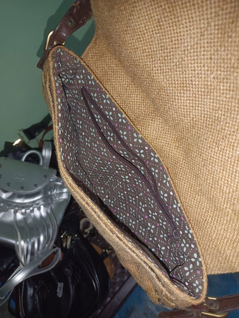 Guess kili Bag (Category: Shoulder Bags) located in Baguio. Submitted by pasabuy_999 (Listing ID 1463548916, Image 2). Description: - Adorable woven shoulder bag - Charming floral detail on the front with playful fringe - Pretty floral pattern on the inside lining - Durable leather strap - Secure metal clasp closure - Ideal for everyday style and convenience.