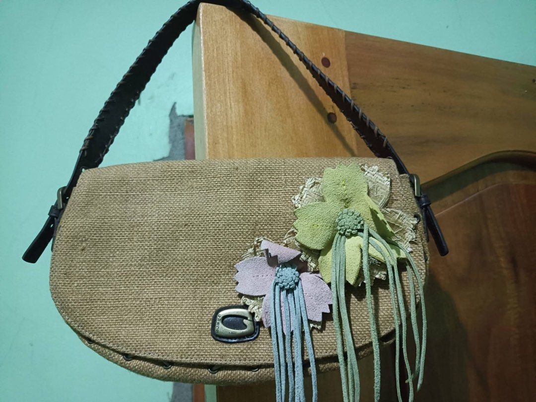 Guess kili Bag (Category: Shoulder Bags) located in Baguio. Submitted by pasabuy_999 (Listing ID 1463548916, Image 1). Description: - Adorable woven shoulder bag - Charming floral detail on the front with playful fringe - Pretty floral pattern on the inside lining - Durable leather strap - Secure metal clasp closure - Ideal for everyday style and convenience.