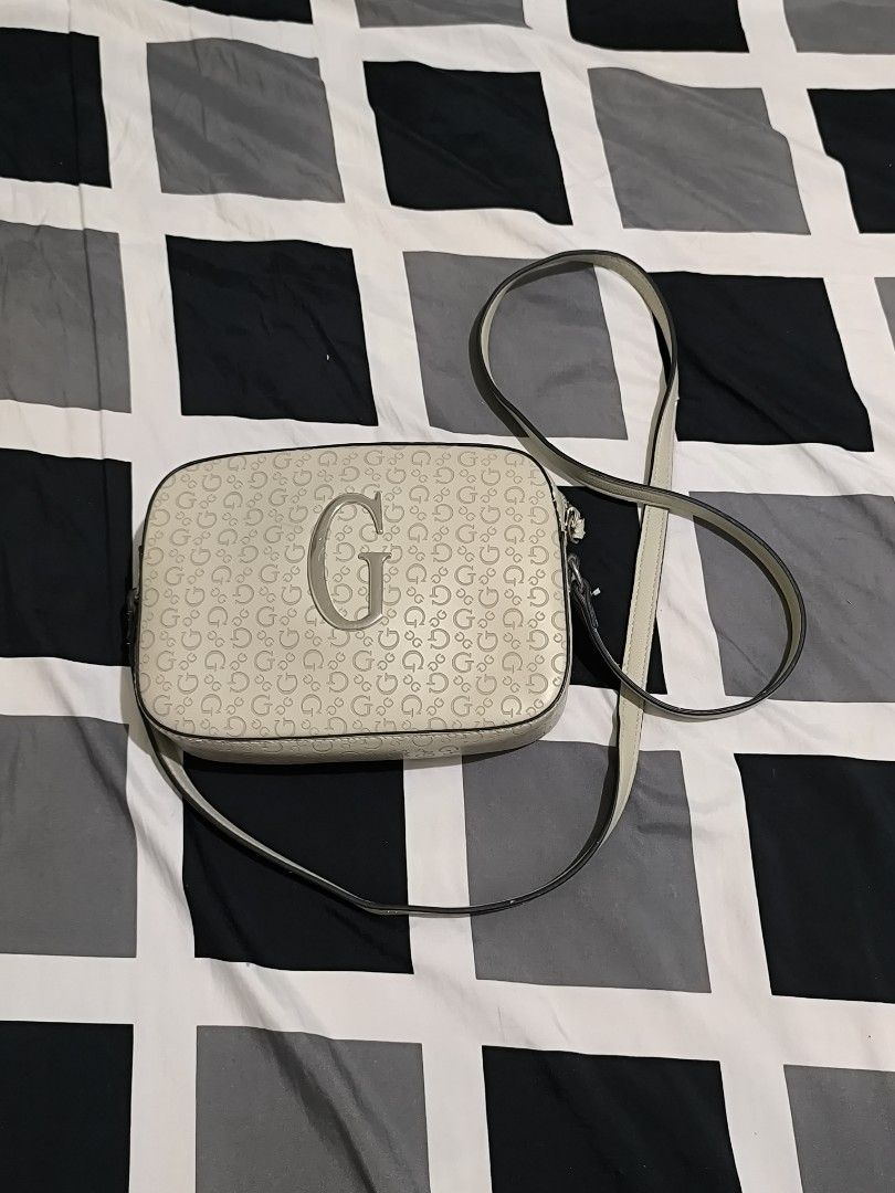 Guess Monogram Crossbody Bag (Category: Cross-body Bags) located in General Santos City (Dadiangas). Submitted by animoya (Listing ID 1463480627, Image 1). Description: - Flaws: Peeling Leather (DM for Close-up) - Authentic - Bought from the United States.