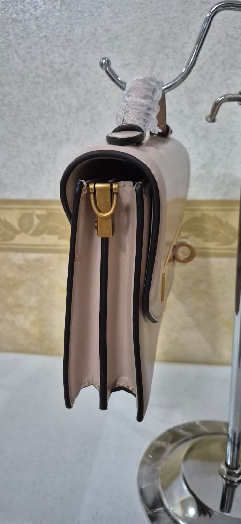 H14-450 Santa Lolla Hard Structured Handbag (Category: Luxury Bags & Wallets) located in Valenzuela. Submitted by dailyhappyfinds (Listing ID 1463439583, Image 3). Description: BRAND: Santa Lolla -Brand new without tag -Handbag only, missing sling strap, with minor dents and hairline scratches on metal part -Please check last photo for details *Mall pullout/ factory pullout. Please manage your expectations..