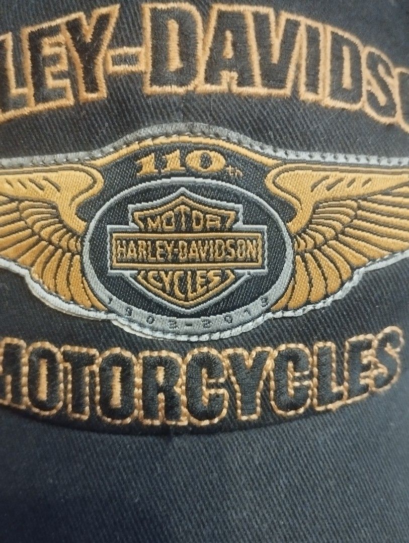 Harley-Davidson 110th Anniversary Motorcycles Baseball Cap (Category: Caps & Hats) located in Baguio. Submitted by katgon2016 (Listing ID 1463419262, Image 2). Description: - Authentic Harley-Davidson Cap - Commemorates 110th Anniversary - Features iconic wing logo and "Motorcycles" text - "Est. 1903" embroidered on the back - Adjustable strap with metal buckle for a custom fit - Ideal for any Harley-Davidson enthusiast.