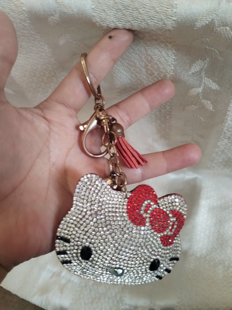 Hello Kitty Rhinestone Keychain with Tassel Charm (Category: Charms) located in Manila. Submitted by malditas (Listing ID 1463552662, Image 1). Description: - Adorable Kitty design - Covered in sparkling rhinestones - Features a cute red bow - Red suede back with Kitty logo - Includes a red tassel and a bell charm - Ideal for personalizing keys or bags From HT box BUY AS IS (NO RETURN, NO EXCHANGE, NO REFUND unless stated) LOCATION For dropping: 