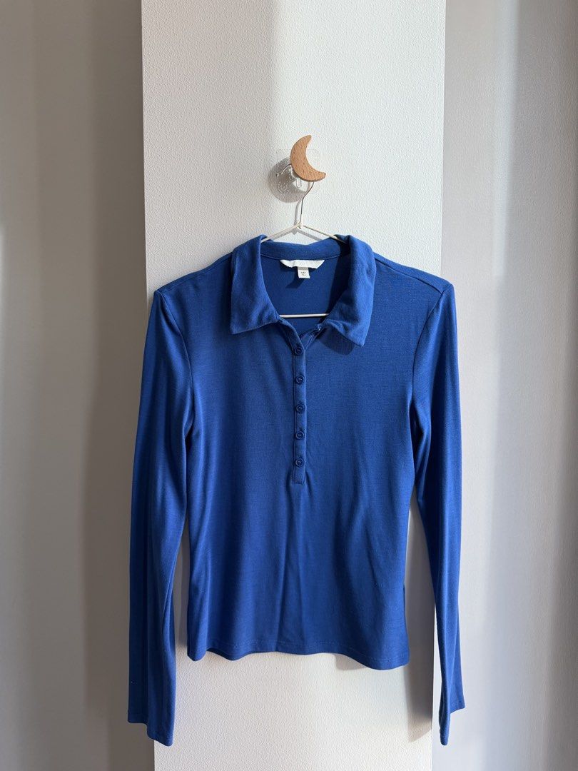 H&M Blue Long Sleeve Polo Shirt (Category: Longsleeves) located in Makati City. Submitted by ariannelaz54133 (Listing ID 1463553701, Image 1). Description: - Brand: H&M - Type: Long sleeve polo shirt - Color: Blue - Fabric: Ribbed texture - Neckline: Button-up - Estimated Size: XS - Style: Great for casual outfits or layering.