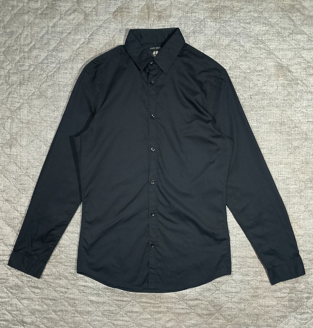 H&M easy iron black button down long sleeves shirt (Category: Formal Shirts) located in Cadiz. Submitted by comradstuff (Listing ID 1463326715, Image 1). Description: H&M easy iron black button down long sleeves shirt w 19" l 29".