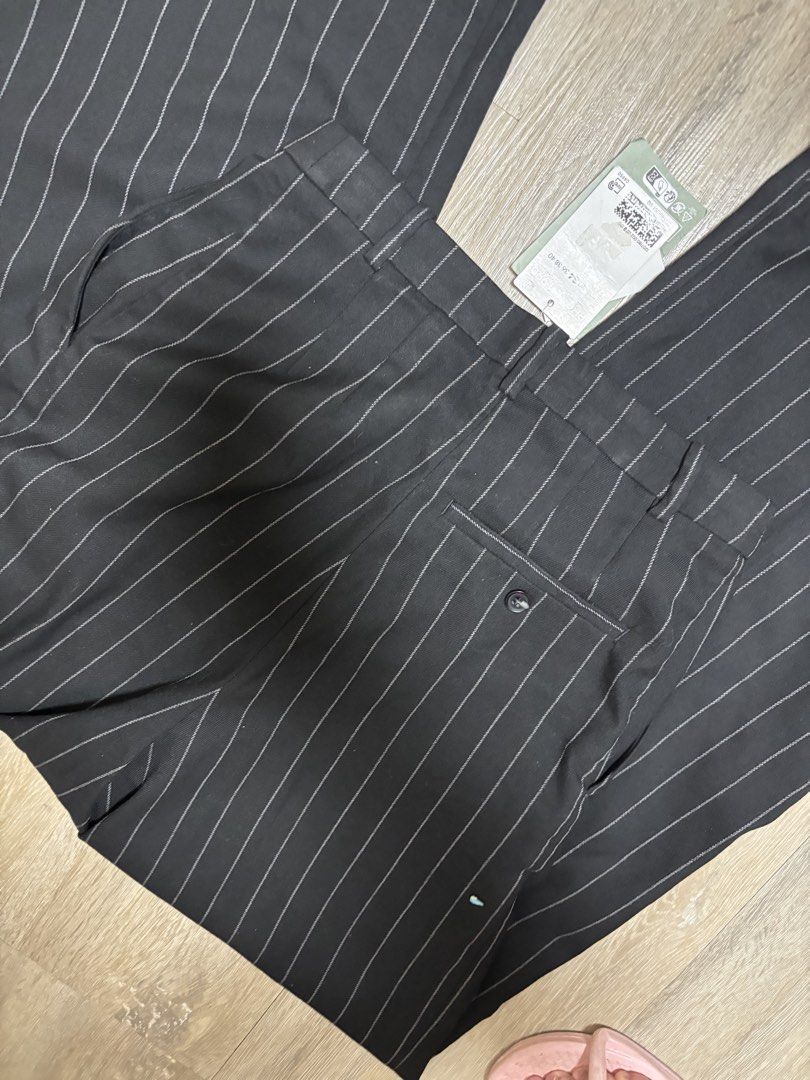 H&M Pinstripe Wide Leg Pants (Category: Jeans) located in Makati City. Submitted by sebastiene (Listing ID 1463552944, Image 3). Description: - Brand: H&M - Color: Black with pinstripes - Style: Wide leg pants - Closure: Front zipper and button, with two waistband buttons - Pockets: Single button pocket on the back - Condition: Brand new with original tag attached - Original Price: PHP 1,990.