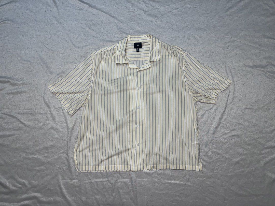 H&M Yellow Striped Button Down (Category: Shirts) located in Quezon City. Submitted by gvsfinds_ (Listing ID 1463492821, Image 2). Description: Cropped H&M yellow pinstripe button down. Size: L Dimensions: - Length: 25 - Width: 22.